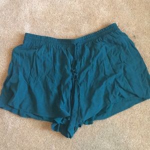 Teal shorts.